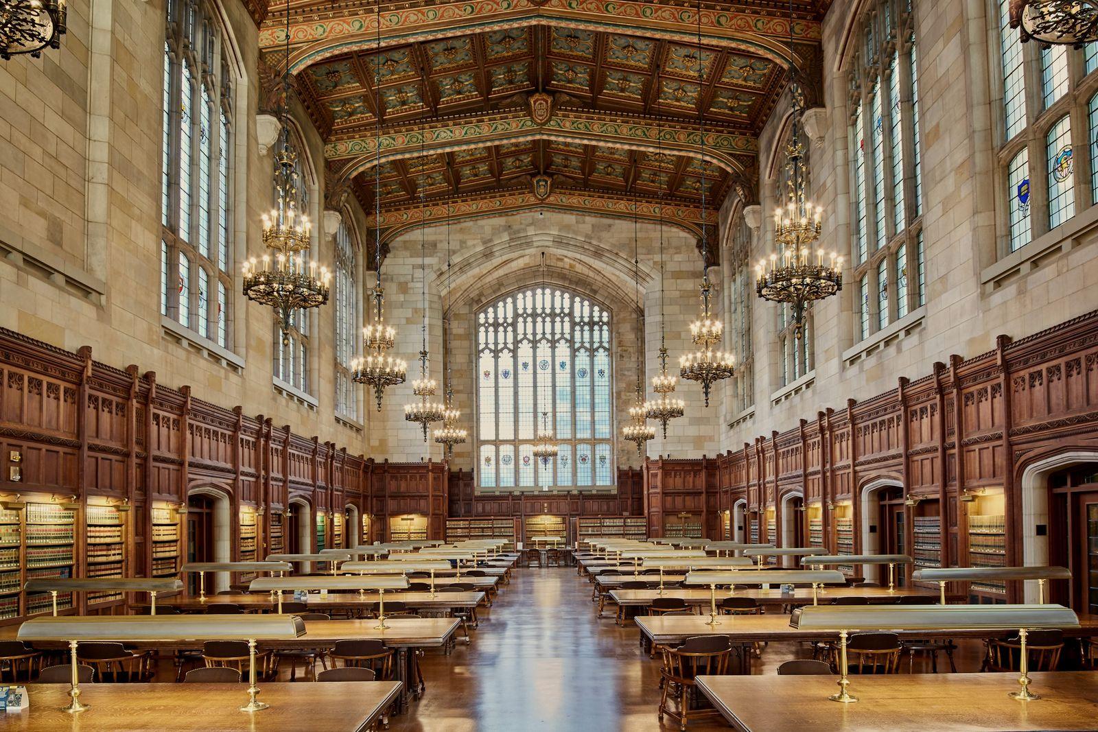 A classic law library with wooden shelves and chandeliers